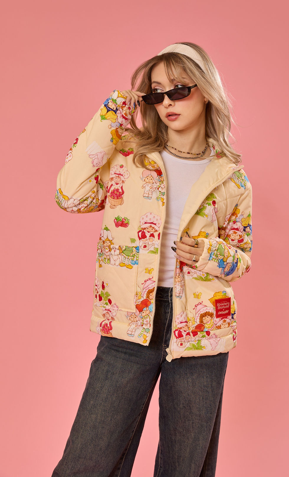 Woman wearing quilted yellow strawberry jacket